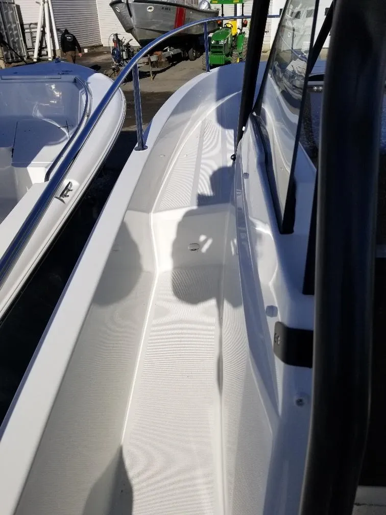 Slide: The Image of 2022 Jeanneau Leader 7.5 WA S3 boat deck with railing and shadow. - 6