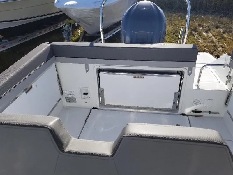 Slide: The Image of 2022 Jeanneau Leader 7.5 WA S3 boat interior with seating and storage. - 9