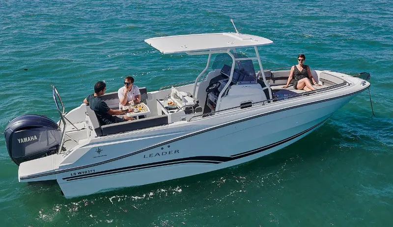 Slide: The Image of 2023 Jeanneau Leader 7.5CC S3 boat cruising with passengers on a sunny day. - 1