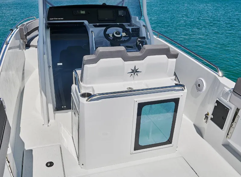Slide: The Image of 2023 Jeanneau Leader 7.5CC S3 boat interior with steering console and seating. - 8