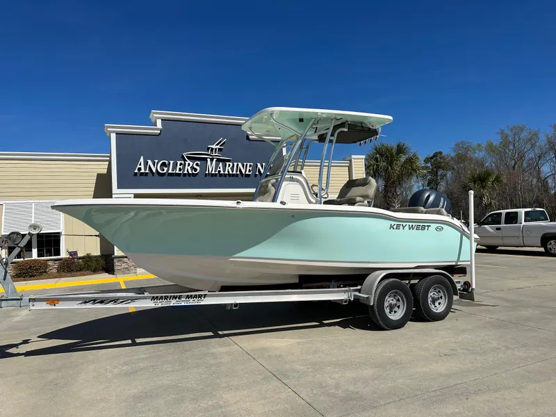 Slide: The Image of 2024 Key West 219 FS boat on trailer at Anglers Marine dealership. - 0