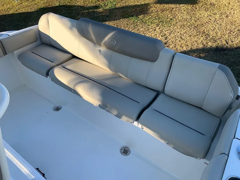 Slide: The Image of 2024 Key West 219 FS boat with beige cushioned seating. - 12