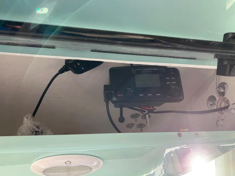 Slide: The Image of VHF radio installed in a 2024 Key West 219 FS boat. - 14