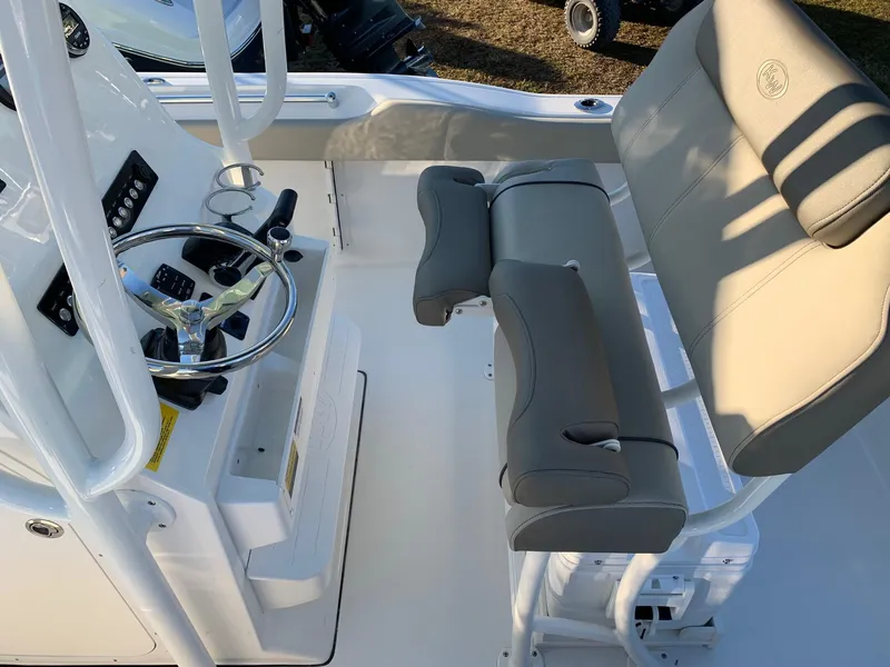 Slide: The Image of 2024 Key West 219 FS boat interior with helm and seating. - 15
