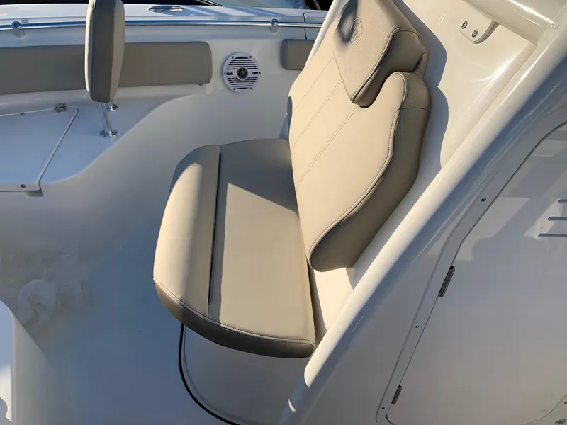 Slide: The Image of 2024 Key West 219 FS boat interior seating and speaker. - 18