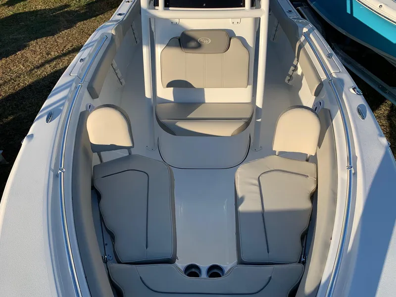 Slide: The Image of 2024 Key West 219 FS boat interior with cushioned seating and storage compartments. - 5