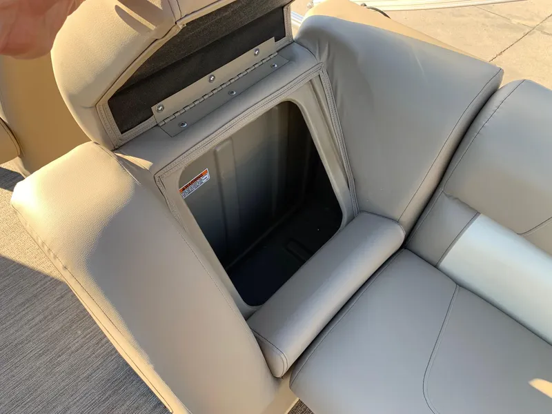 Slide: The Image of 2024 Starcraft LX22 R boat seat storage compartment. - 7