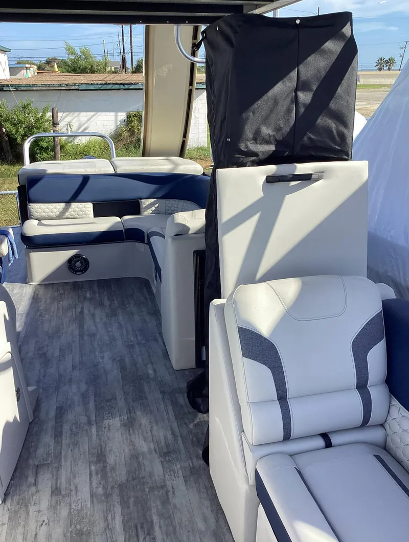 Slide: The Image of 2022 Crest CARIBBEAN LX 250 L pontoon boat interior with modern seating. - 10