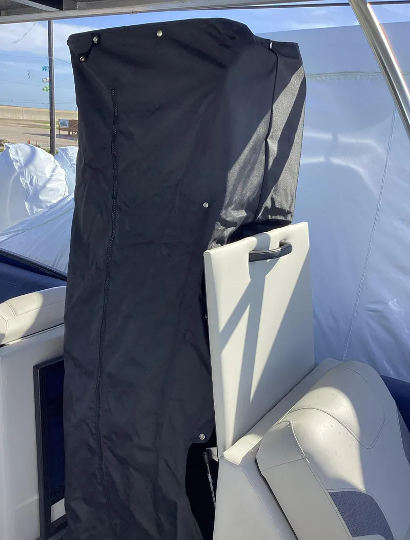 Slide: The Image of 2022 Crest CARIBBEAN LX 250 L boat interior with covered seat. - 12