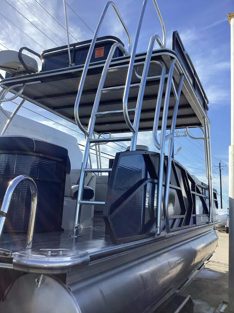 Slide: The Image of 2022 Crest CARIBBEAN LX 250 L pontoon boat with upper deck and seating. - 3
