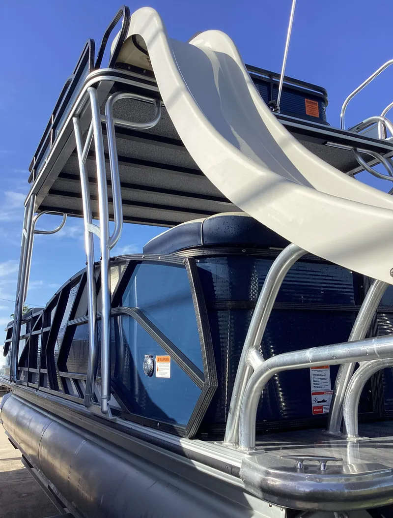 Slide: The Image of 2022 Crest CARIBBEAN LX 250 L pontoon boat with slide, blue exterior. - 5