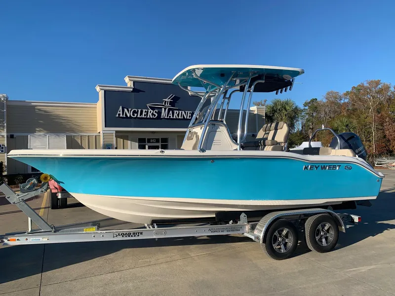 Slide: The Image of 2024 Key West 219 FS boat on trailer at Anglers Marine dealership. - 0