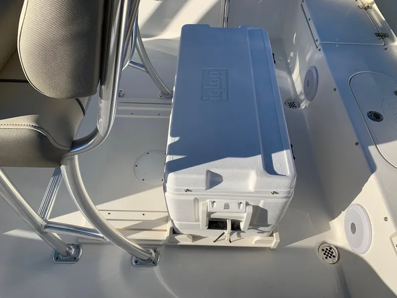 Slide: The Image of 2024 Key West 219 FS boat interior with Igloo cooler and seating. - 10