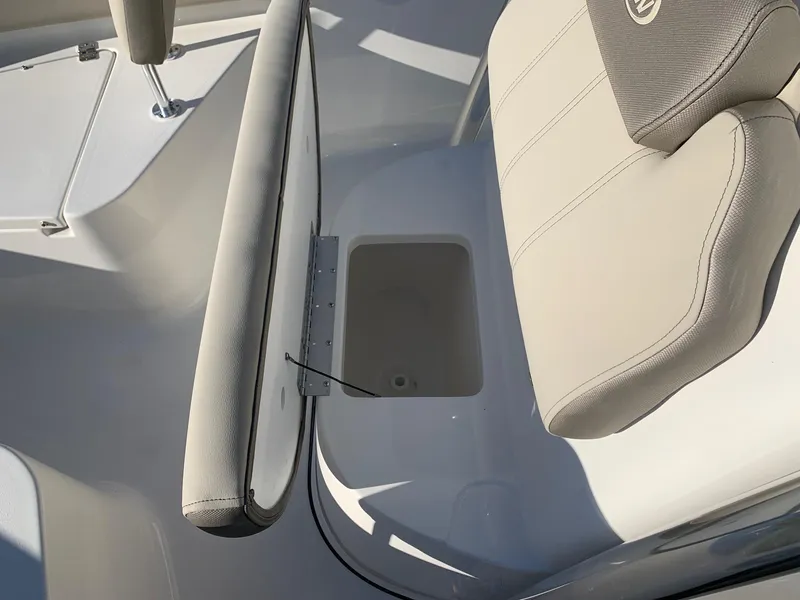 Slide: The Image of 2024 Key West 219 FS boat interior seating and storage compartment. - 18