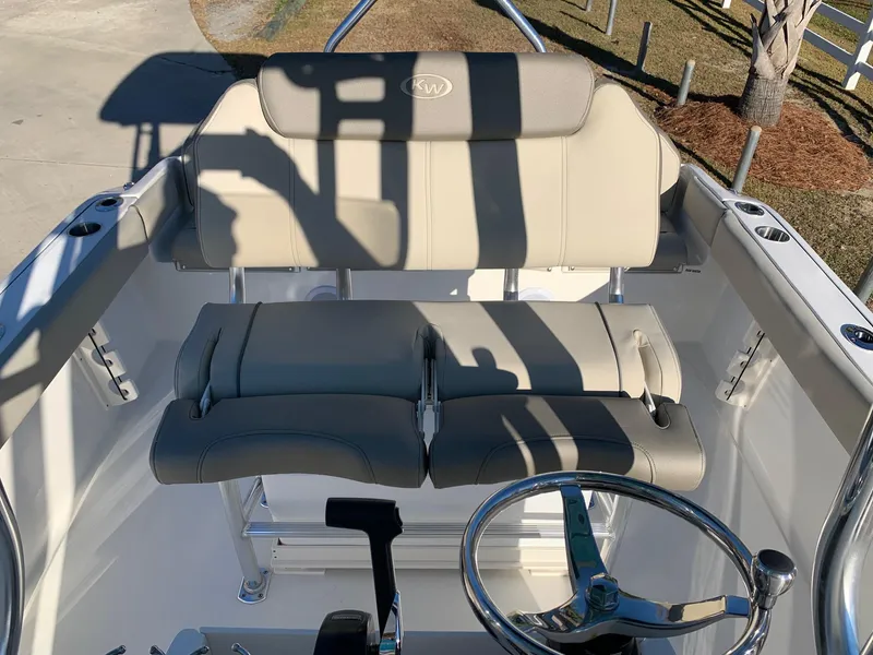 Slide: The Image of 2024 Key West 219 FS boat cockpit with dual seats and steering wheel. - 3