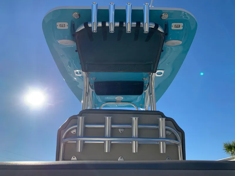 Slide: The Image of 2024 Key West 219 FS boat, viewed from below, showcasing the T-top and rod holders. - 12