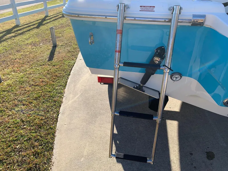 Slide: The Image of 2024 Key West 219 FS boat with a stainless steel swim ladder. - 13