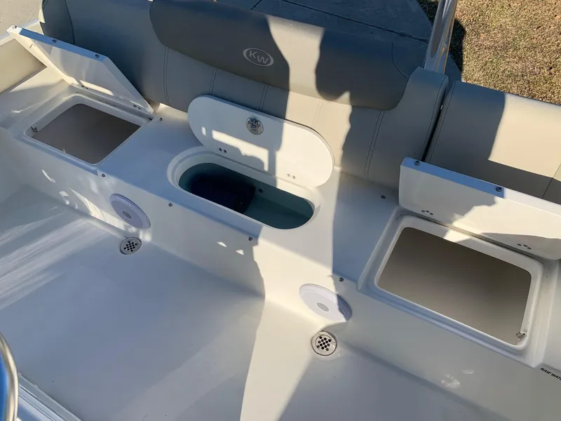 Slide: The Image of 2024 Key West 219 FS boat interior with storage compartments and seating. - 8