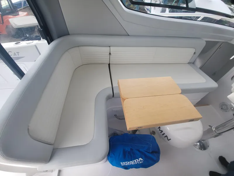 Slide: The Image of Interior seating area of 2024 ArrowCat 320 with foldable table. - 4