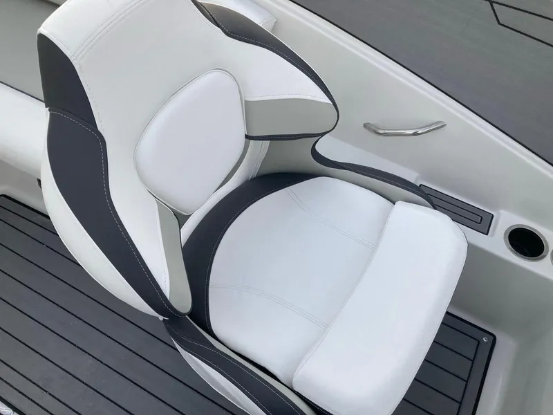 Slide: The Image of 2024 Starcraft SVX 210 boat seat with white and black upholstery. - 10