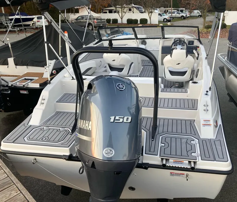 Slide: The Image of 2024 Starcraft SVX 210 boat with Yamaha 150 outboard motor, rear view. - 4