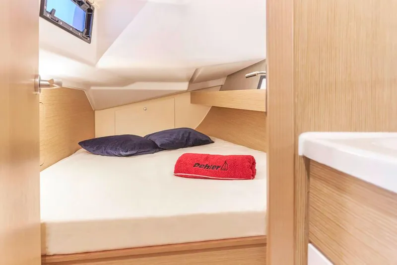 Slide: The Image of Woman dining in the cozy interior of a 2025 Dehler 38 SQ sailboat. - 23