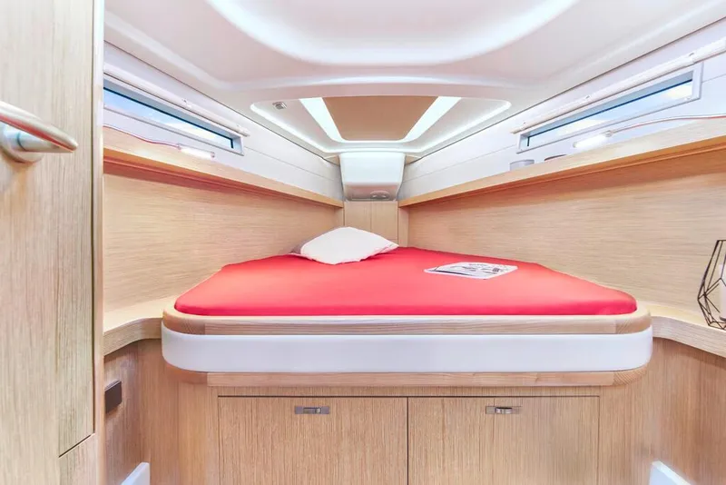 Slide: The Image of Woman relaxing in the cabin of a 2025 Dehler 38 SQ yacht. - 28