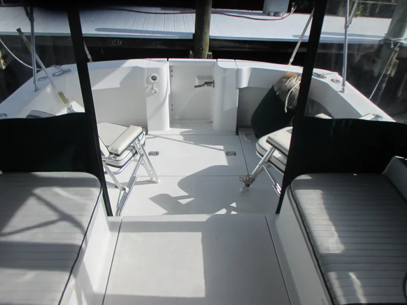 Slide: The Image of 2000 Mainship 30 PILOT boat interior with seating and deck area. - 9