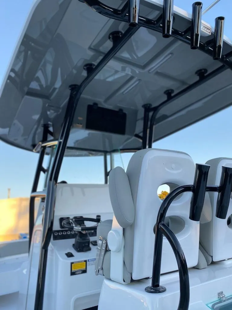 Slide: The Image of 2024 Cape Horn 24 XS boat interior with T-top and seating. - 10