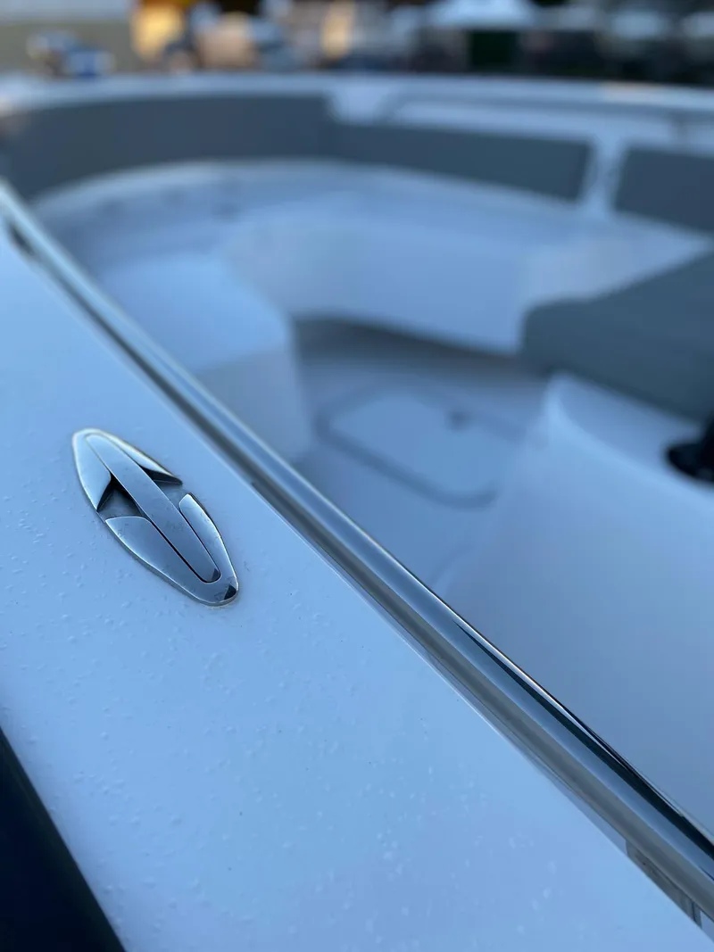 Slide: The Image of 2024 Cape Horn 24 XS boat interior with sleek design and seating area. - 15