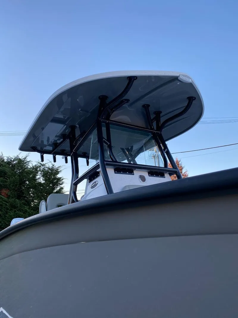 Slide: The Image of 2024 Cape Horn 24 XS boat with T-top against a clear sky. - 2