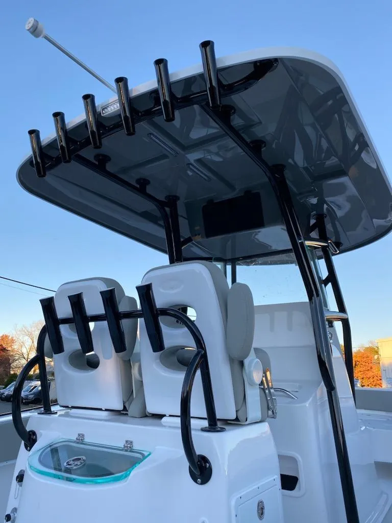 Slide: The Image of 2024 Cape Horn 24 XS boat with T-top and rod holders. - 4