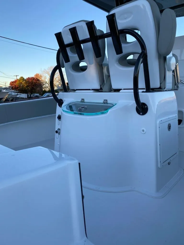 Slide: The Image of 2024 Cape Horn 24 XS boat interior with rod holders and seating. - 5