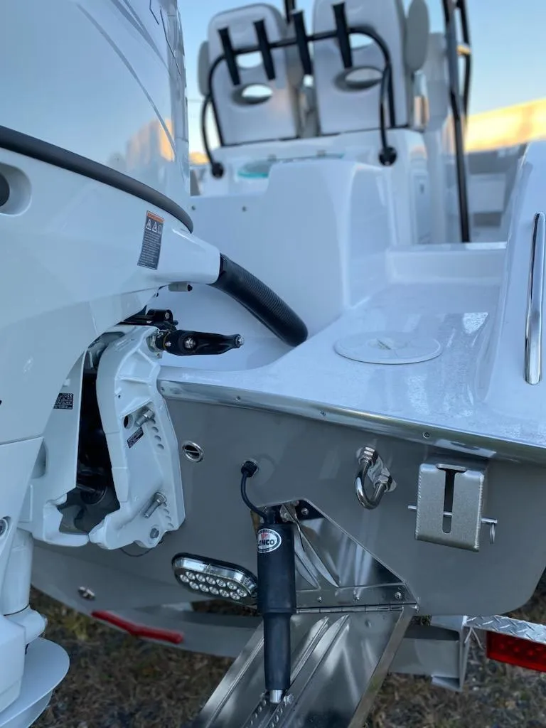 Slide: The Image of 2024 Cape Horn 24 XS boat stern and engine detail. - 7