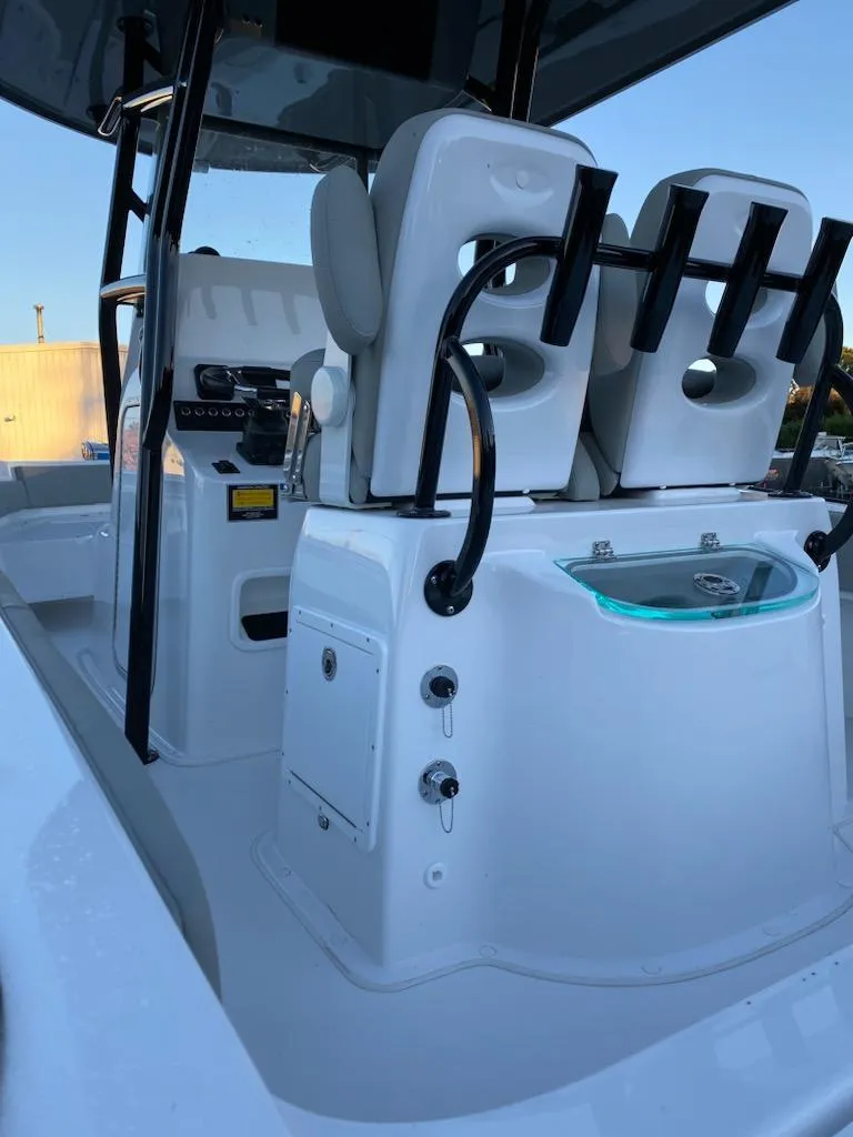 Slide: The Image of 2024 Cape Horn 24 XS boat interior with seating and control panel. - 9