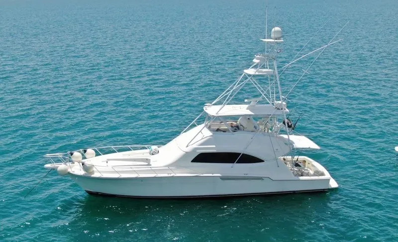 The Image of 2005 Bertram 570 yacht on clear blue water. - 0