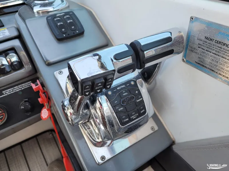 Slide: The Image of 2014 Formula 290 BR boat throttle and control panel. - 13