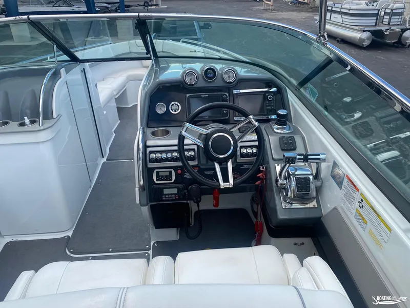 Slide: The Image of 2014 Formula 290 BR boat cockpit with steering wheel and control panel. - 14