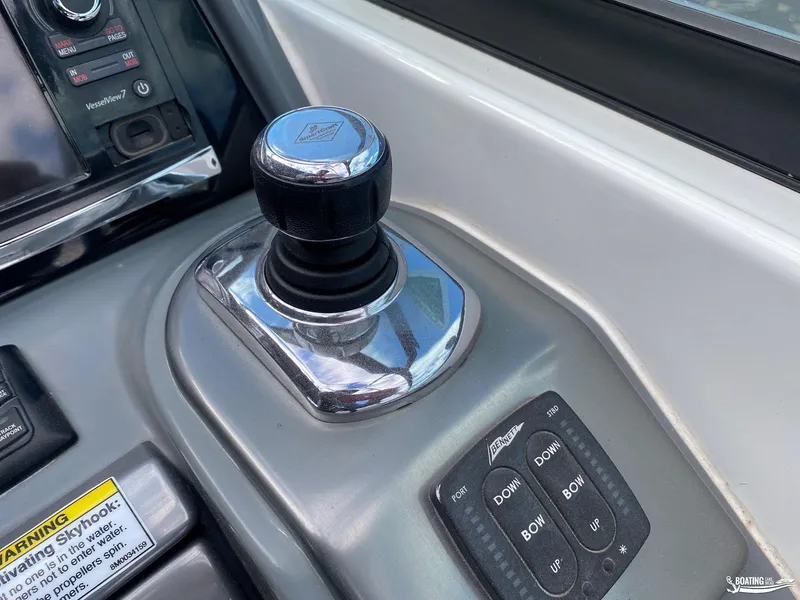 Slide: The Image of Close-up of 2014 Formula 290 BR boat control panel with joystick and trim tab controls. - 16