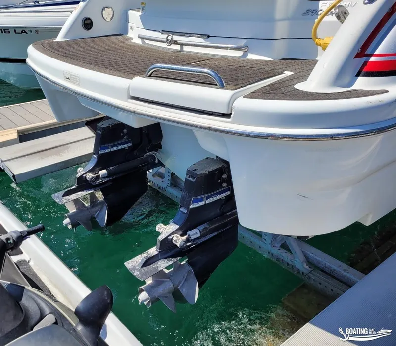 Slide: The Image of 2014 Formula 290 BR boat with dual propellers docked at marina. - 17