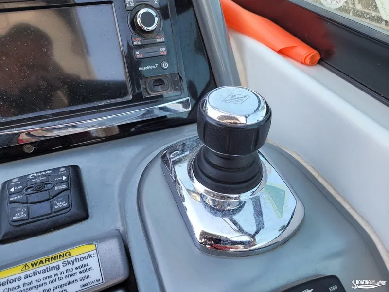 Slide: The Image of Close-up of 2014 Formula 290 BR boat control panel with joystick and warning label. - 21