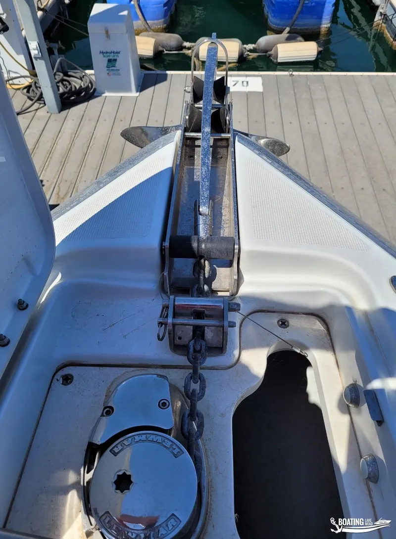 Slide: The Image of Anchor system of a 2014 Formula 290 BR boat docked at a marina. - 23