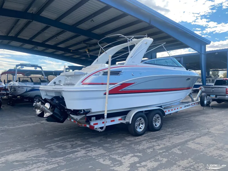 Slide: The Image of 2014 Formula 290 BR boat on a trailer under a covered storage area. - 28