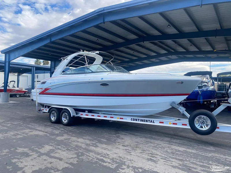 Slide: The Image of 2014 Formula 290 BR boat on a Continental trailer under a covered storage area. - 29