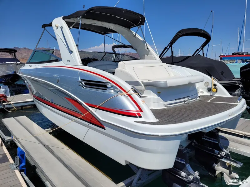 Slide: The Image of 2014 Formula 290 BR boat docked at marina, rear view. - 5