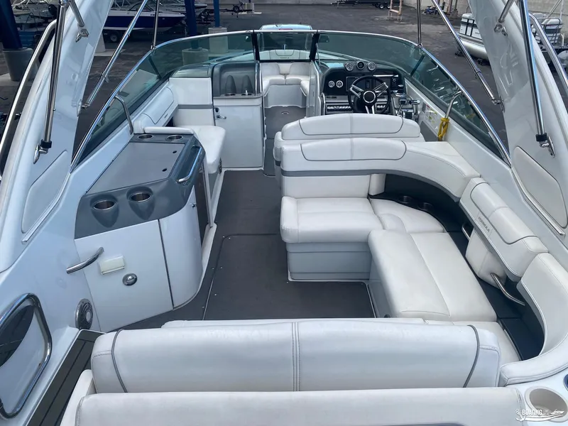 Slide: The Image of 2014 Formula 290 BR boat interior with white leather seating and modern dashboard. - 7