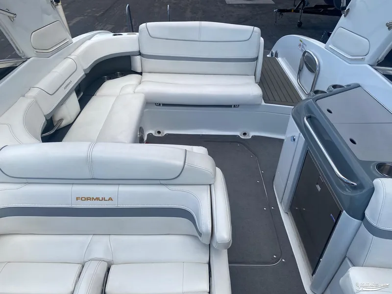 Slide: The Image of 2014 Formula 290 BR boat interior with white leather seating and modern amenities. - 9