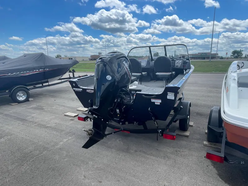 Slide: The Image of 2021 Tracker Pro Guide V-16 WT boat with outboard motor on trailer. - 3