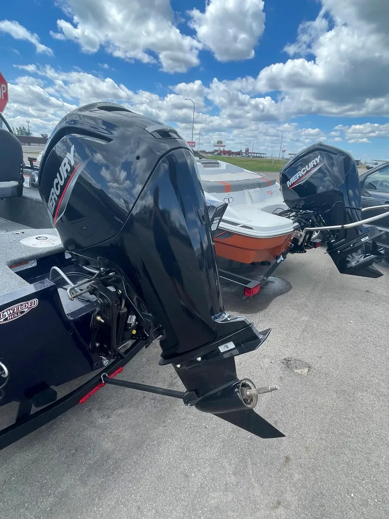 Slide: The Image of 2021 Tracker Pro Guide V-16 WT boat with Mercury outboard motors. - 5