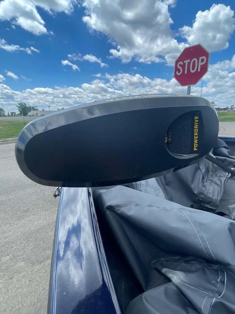 Slide: The Image of 2021 Tracker Pro Guide V-16 WT boat with PowerDrive motor, stop sign in background. - 6